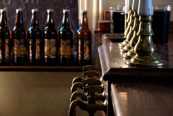 Close up of pub beer engine and bottles, at the Black Country Li